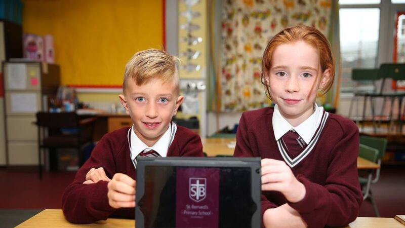 St Bernard&#39;s pupils Adam McCann and Grace Higgins show off their new app. Picture by Mal McCann 