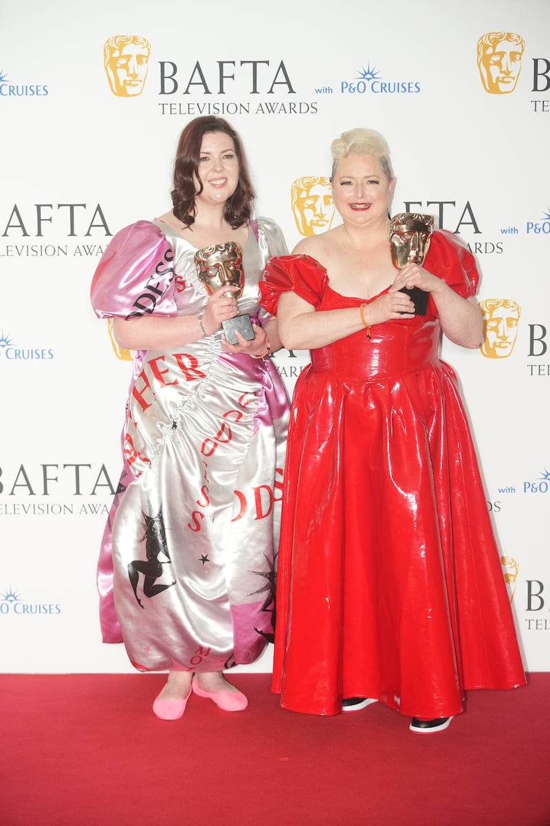 Lisa McGee and Siobhan McSweeney with the award for Scripted Comedy, for Derry Girls, at the Bafta Television Awards. Picture, Jeff Moore/PA Wire