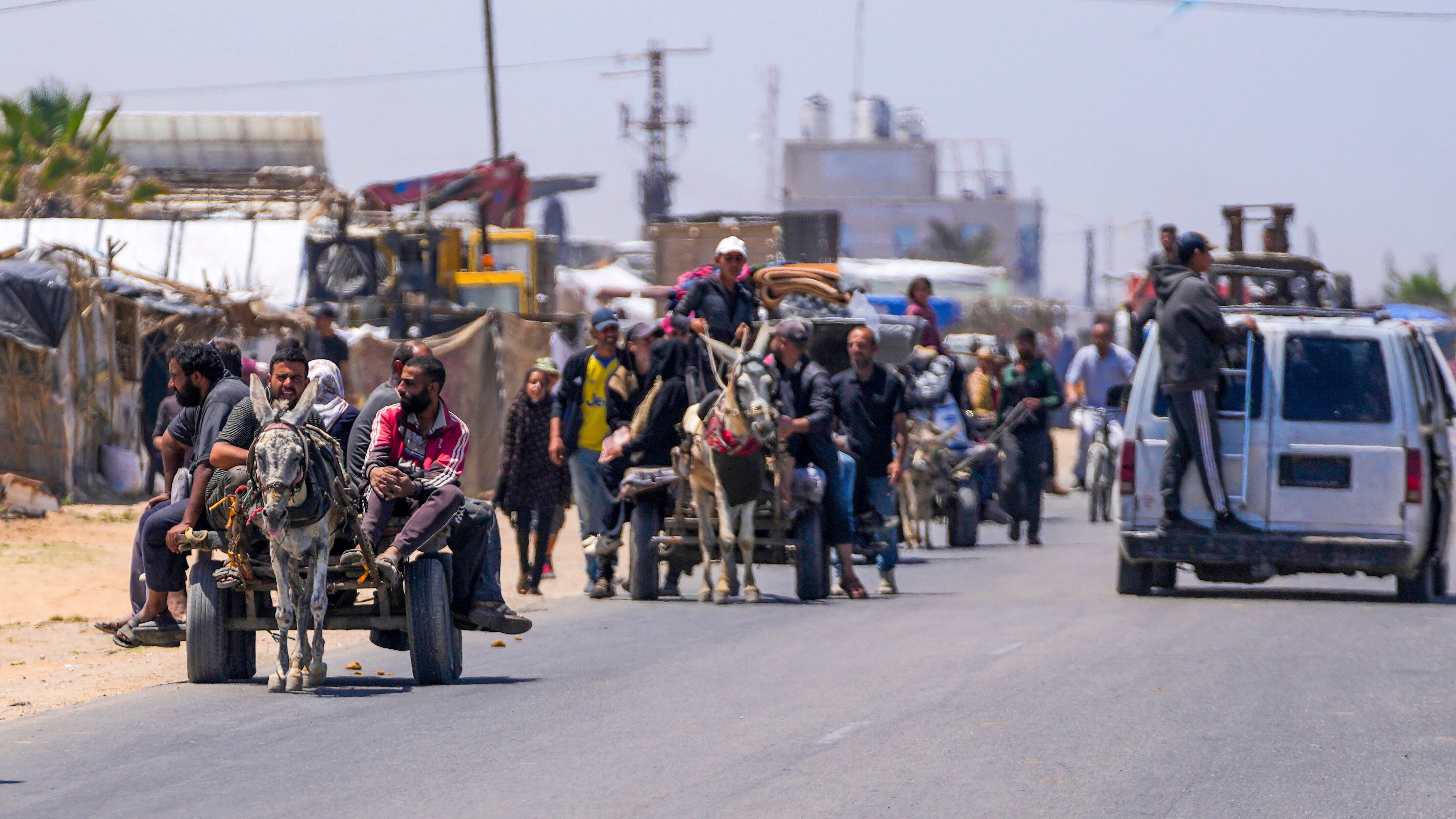 Displaced Palestinians arrive in central Gaza after fleeing from Rafah (Abdel Kareem Hana/AP)