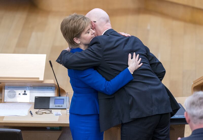 Nicola Sturgeon and John Swinney embrace after her final session of First Minister’s Questions in 2023