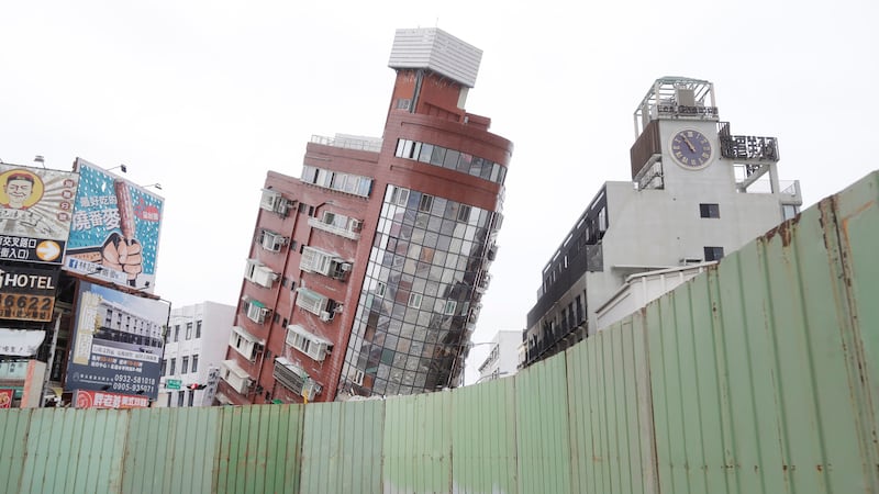 A building is seen partially collapsed, two days after a powerful earthquake struck the city, in Hualien, eastern Taiwan (Chiang Ying-ying/AP)