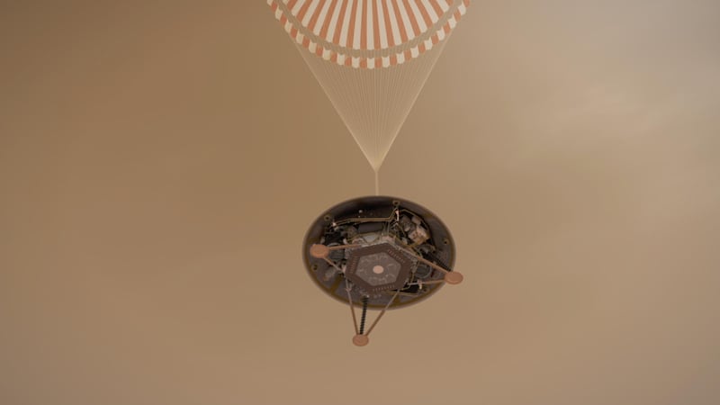 A simulated view of Nasa's InSight lander descending towards the surface of Mars