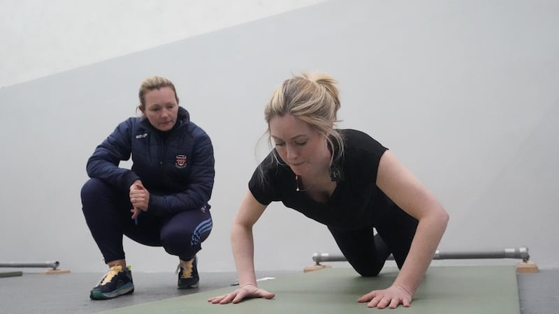 Instructor Garda Orla O’Donnell monitors journalist Dyane Connor taking part in a fitness test during a recruitment campaign launch at the Garda training centre in Templemore, co Tipperary