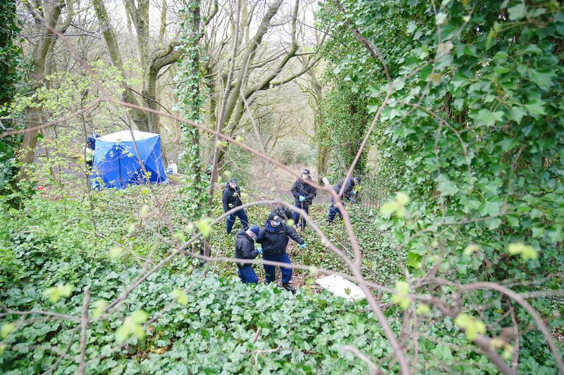 Police officers search Kersal Dale Wetlands, near Salford, after human remains were found