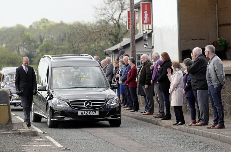 PACEMAKER,BELFAST,7/5/2020: Local people line the footpaths as the funeral cortege of former SDLP MLA John Dallat arrives at St Mary&#39;s church outside Kilrea in Co. Derry..PICTURE BY STEPHEN DAVISON. 