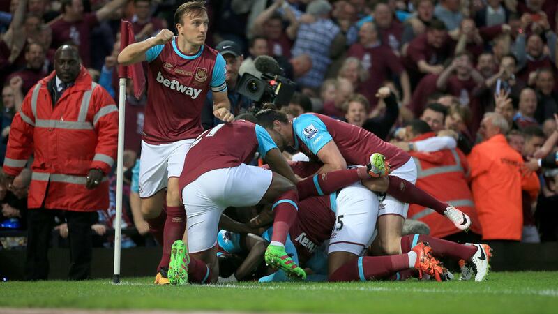 West Ham United's Diafra Sakho is mobbed by team-mates after scoring against Manchester United at Upton Park in May 2016&nbsp;