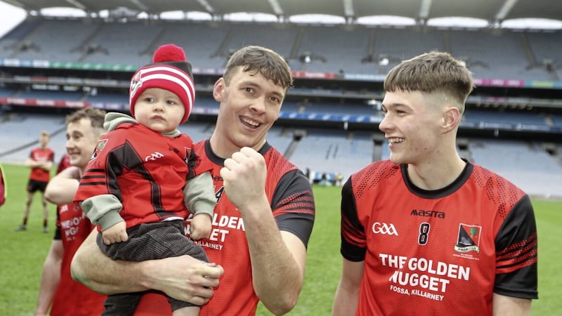 Kerry superstar David Clifford (holding his son, Ogie) scored 0-11 to help his club Fossa beat Stewartstown Harps in the AIB Club All-Ireland JFC Final. Pic Philip Walsh 
