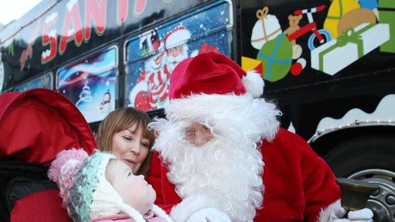 Young Maggie Maguire goes on board the Santa bus at the Northern Ireland Children's Hospice&nbsp;