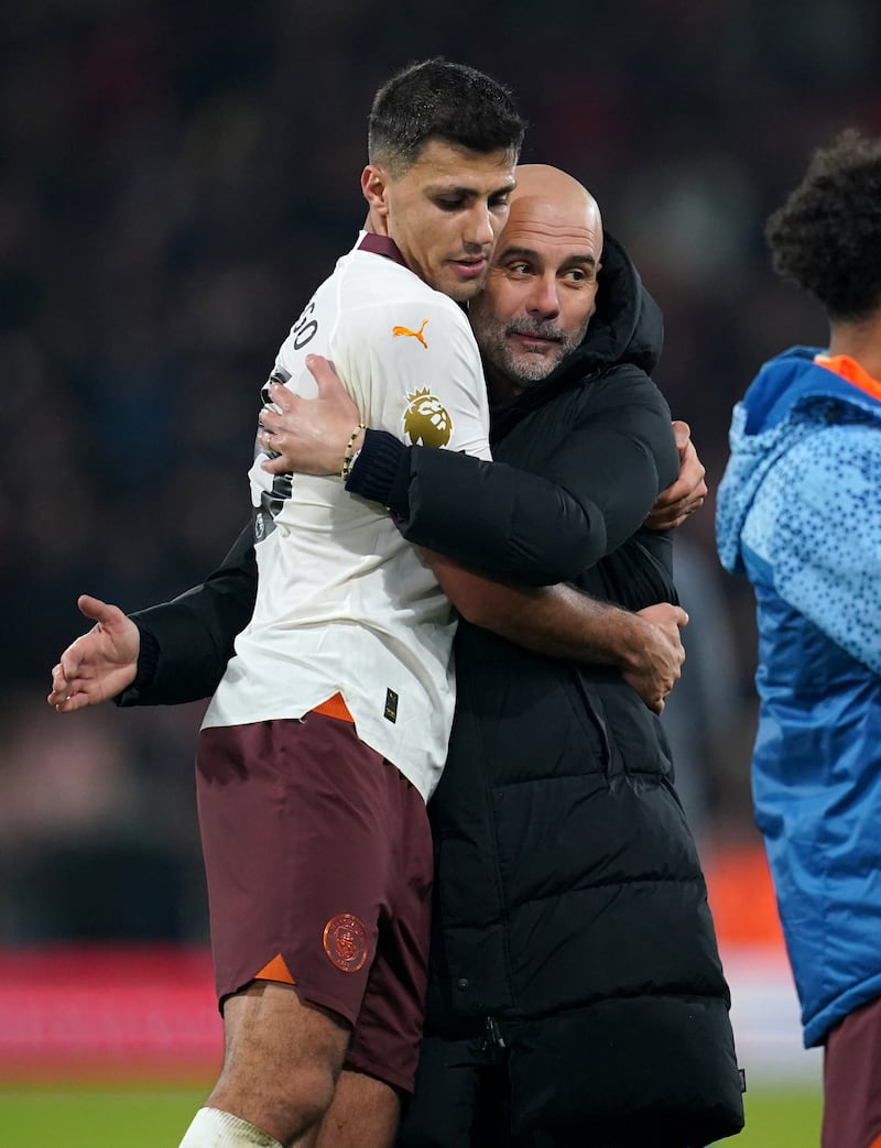 Manchester City manager Pep Guardiola hugs Rodri after a 1-0 win over Bournemouth