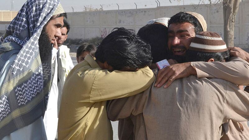Pakistani family members of victims mourn outside a police training center where gunmen opened fire, in Quetta, Pakistan&nbsp;