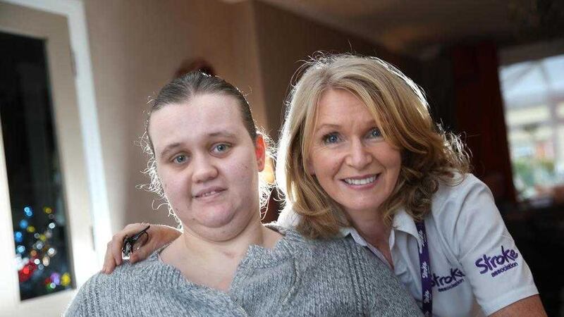 Leah Batchelor pictured at home with Carmel Lavery of the Stroke Association. Picture by Hugh Russell. 