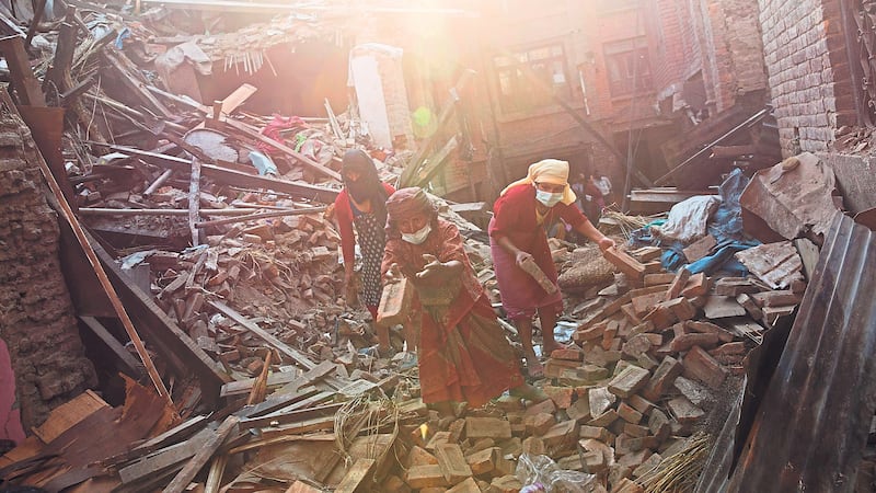 DEVASTATION: Nepalese women remove debris searching their belongings from their house that was destroyed a week ago during the earthquake in Bhaktapur, Nepal <br />PICTURE: Bernat Amangue/AP<br />            <br />&nbsp;