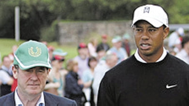 US golfer Tiger Woods in conversation with JP McManus (left) during the JP McManus Invitational Pro-Am Tournament at Adare Manor in 2010. File picture by Julien Behal, Press Association 