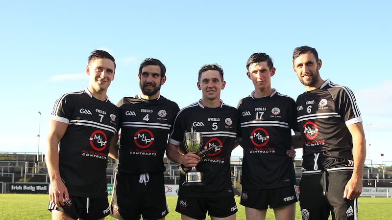 &nbsp;From left, Aaron Branagan, Niall Branagan, Darryl Branagan, Darryl Branagan, Eugene Branagan and Aidan Branagan with the Frank O&rsquo;Hare Cup following their win over Clonduff in the Down Senior Football Championship final, their fifth title in-a-row. Picture by Philip Walsh