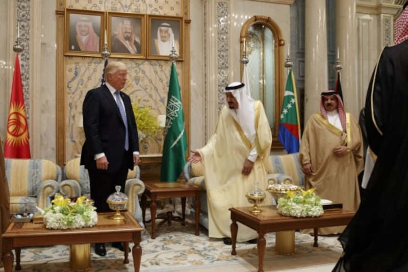 Saudi King Salman invites Trump to sit (Evan Vucci/AP)