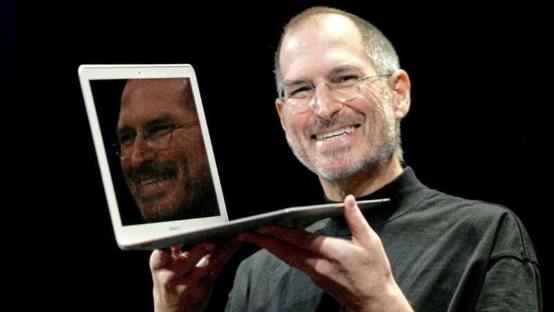 The late Apple founder Steve Jobs with a MacBook 