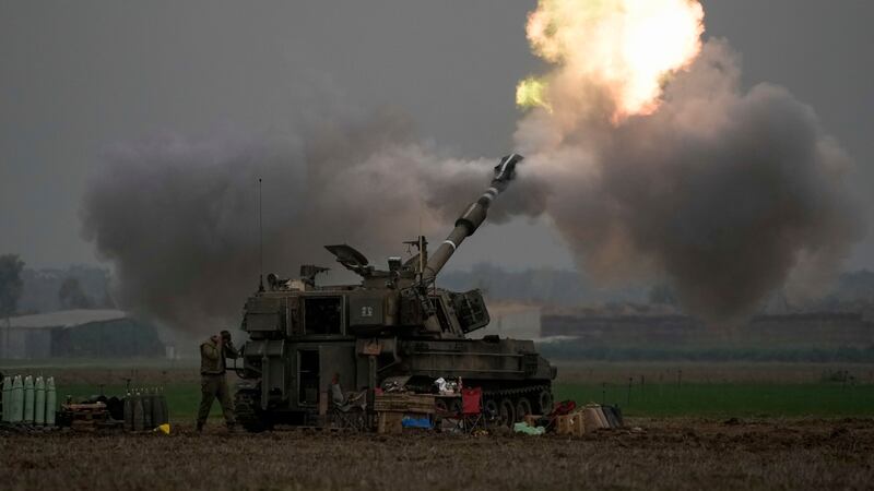 An Israeli mobile artillery unit fires a shell from southern Israel towards the Gaza Strip (Leo Correa/AP)