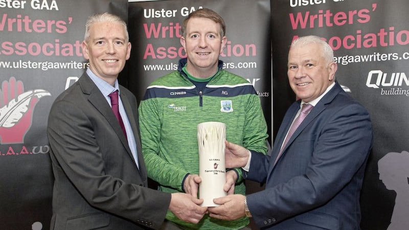 Ronan Gallagher receives the Quinn Building Products-UGAAWA February Merit Award, on behalf of Seamus Quigley, from UGAAWA chairman John Martin (left) and Seamus McMahon, Quinn Building Products Sales &amp; Marketing Director. Picture by Jim Dunne 