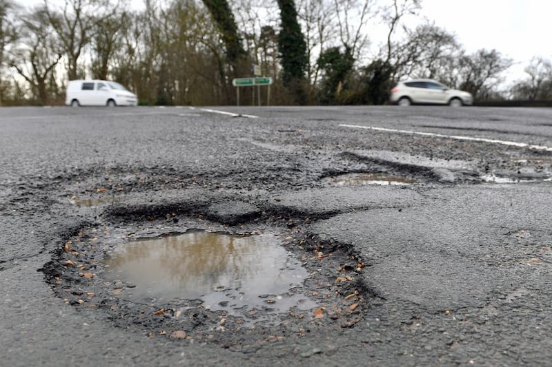 Takes lots of photos of the pothole, as this can stand you in better chance of receiving compensation.