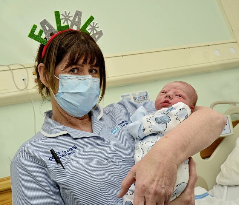 Gerald Og Clarke, pictured with Ann Doherty, was born at 3.58am on Christmas Day, weighing 6lb 13oz this morning. Picture by Arthur Allison/Pacemaker Press 