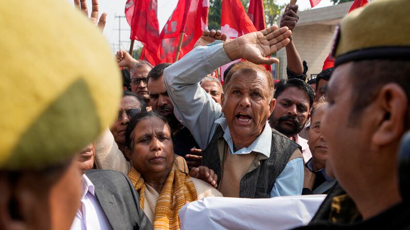 Trade union members and farmers protest at new agriculture laws in Jammu (AP Photo/Channi Anand)