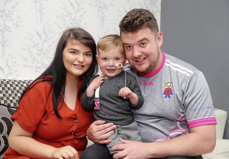 Little Daithi MacGabhan with his parents Seph and Mairtin. Picture by Mal McCann