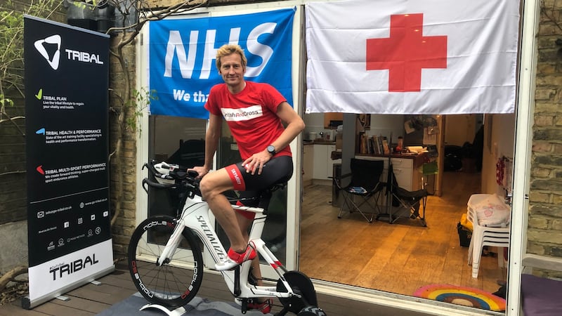 Neil Clark, 51, cycled on a static bike, swam in a three-metre pool while tethered to his house and ran 1,700 laps of his lawn.