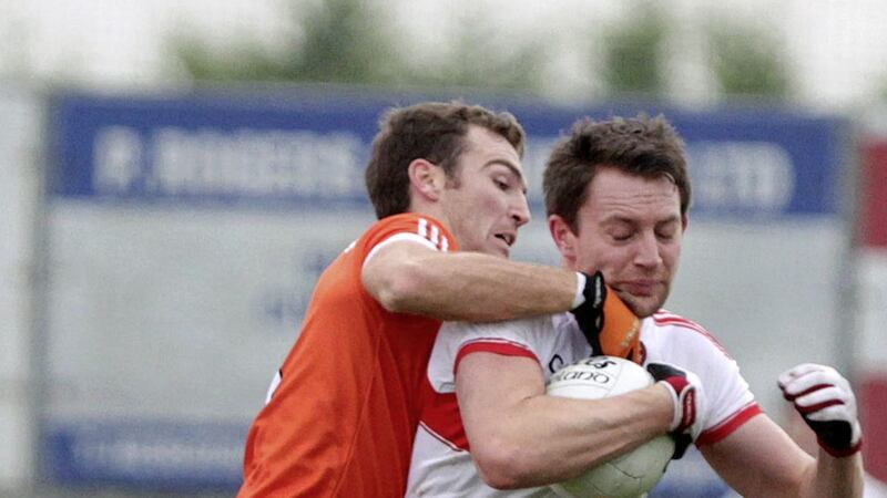 Armagh's Brendan Donaghy gets to grips with Derry's James Keilt during Sunday's &Oacute; Fiaich Cup semi-final in Crossmaglen<br />Picture by Colm O'Reilly
