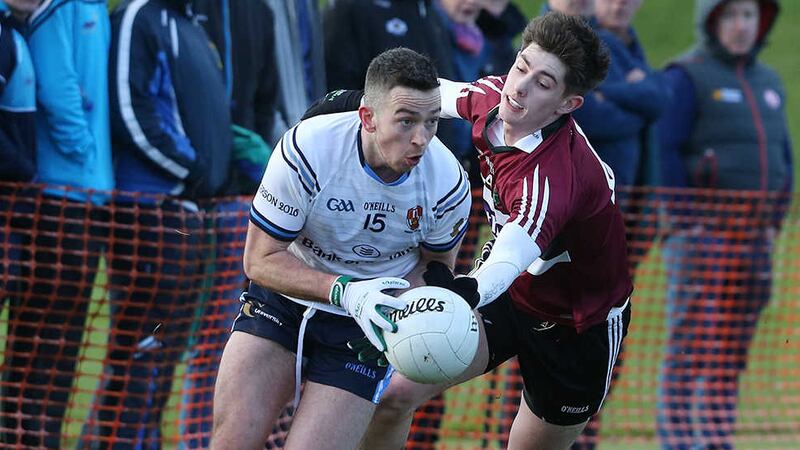 UUJ's Evin Regan gets away from Patrick McAleer of St Mary's.  Picture By Hugh Russell&nbsp;