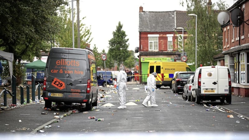 Forensics officers at the scene in Claremont Road, Moss Side, Manchester, where ten people, including two children were taken to hospital after reports of gunshots at a street party Picture by Peter Byrne/PA 