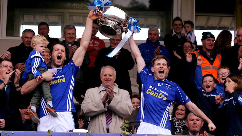 Scotstown joint captains Francis Caulfield and Donal Morgan lifting the Mick Duffy cup
