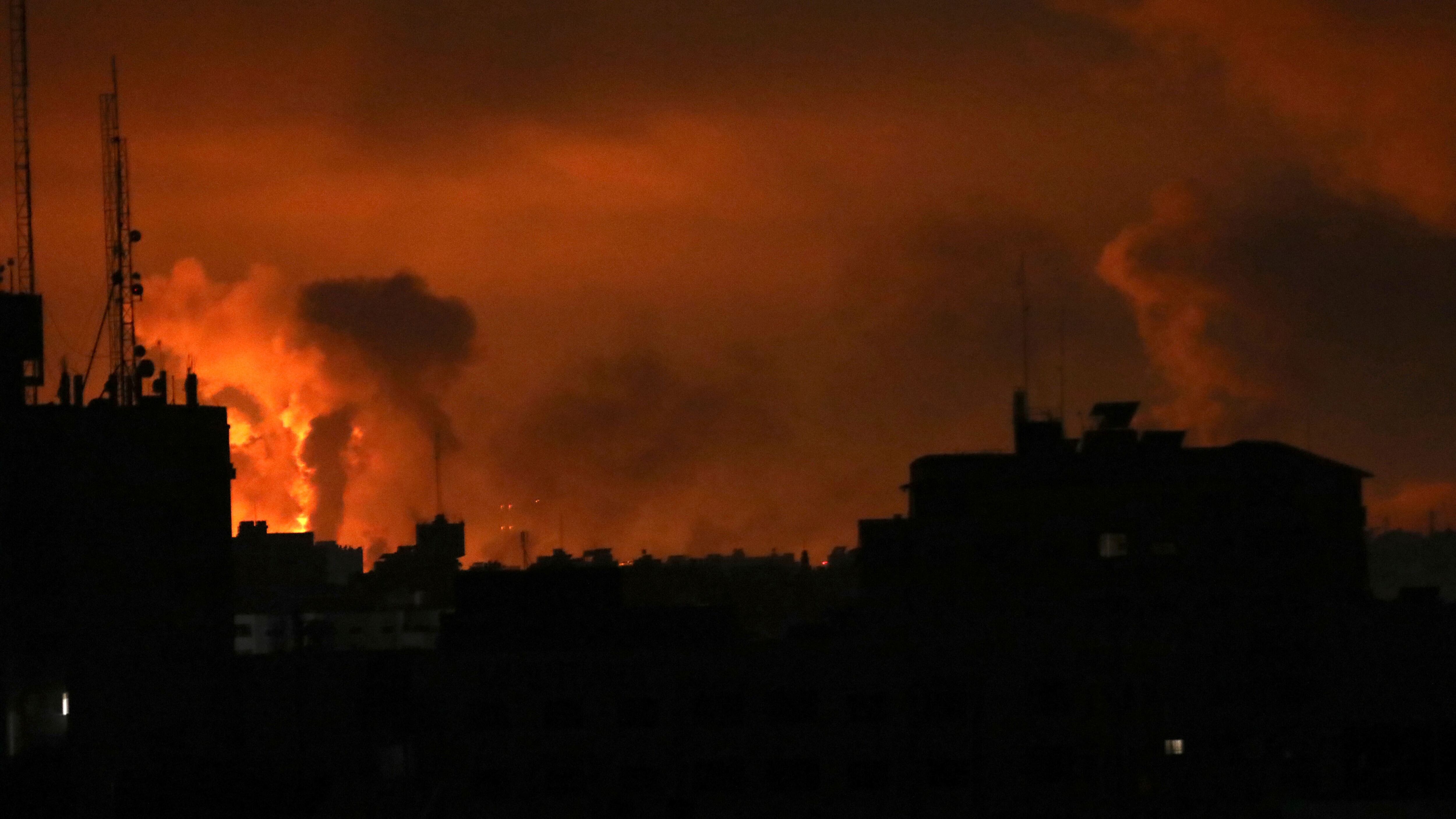 Explosions light up the sky above Gaza (Abed Khaled/AP)
