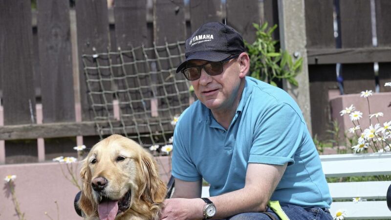 Newry man David McClurg and his guide dog Paxton. Picture by Hugh Russell 