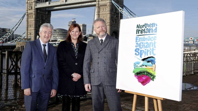 Launching the Tourism NI/Tourism Ireland new destination brand at World Travel Market in London are (from left) Tourism NI&rsquo;s chief executive John McGrillen and head of GB Julie Wakley with Northern Ireland-based artist Colin Davidson.Photo: William Cherry/PressEye 