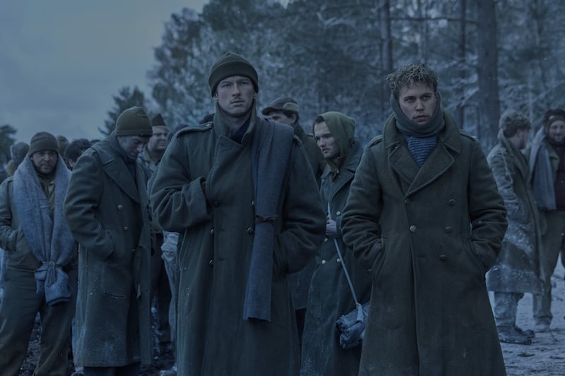 John 'Buck' Egan (Callum Turner) and Gale 'Buck' Cleven (Austin Butler) in a forced march while POWs in Germany