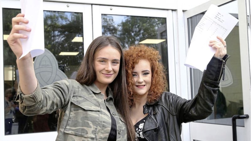 Cara Gorman and Eimear Mulgrew with their GCSE results on the last year of Little Flower Girls&#39; School. Picture by Hugh Russell 