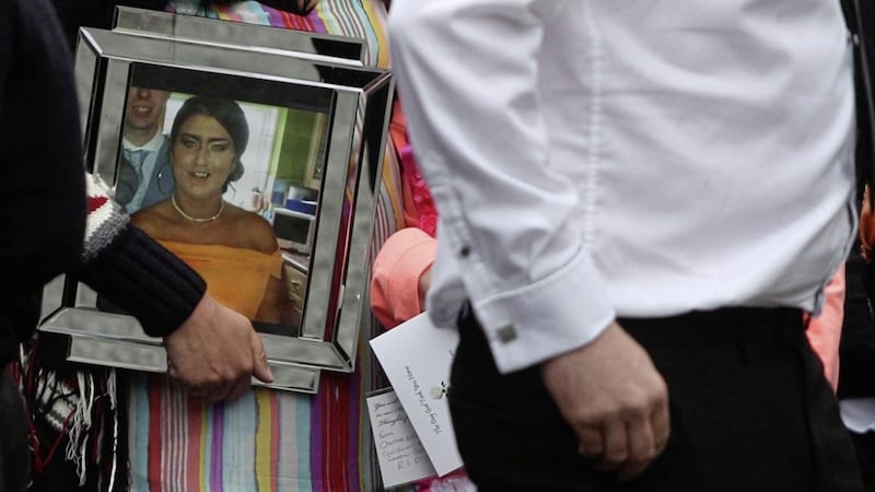 Some mourners carried photographs of Joleen Corr, who was laid to rest in the City Cemetery. Picture by Matt Bohill 