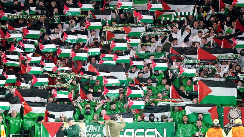 Celtic supporters show their support for the people of Palestine before the Champions League game against Atletico Madrid