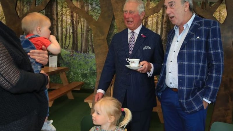 &nbsp;Prince of Wales (centre) meeting Kerry Lynn, holding her 9-month-old daughter Margot Dixon, with Esme Dixon, 2, and Denis Lynn, at the Finnebrogue Artisan event in Downpatrick, Co Down. Tributes have been paid to the prominent Northern Ireland businessman, Denis Lynn, who has died.