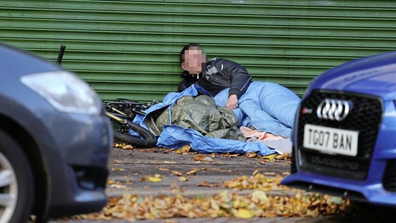 A homeless man wrapped in a sleeping bag on on the Upper Ormeau Road Picture Mal McCann. 
