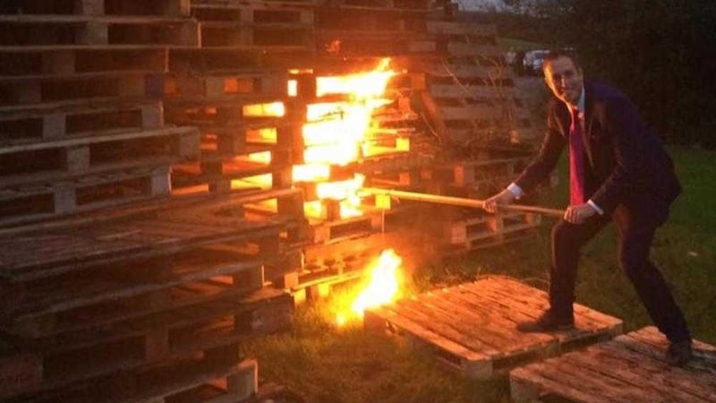 DUP communities minister Paul Givan lights an Eleventh Night bonfire 