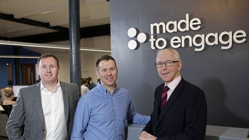 Steven Cassin and Stephen Leathem from Made to Engage, with Brian Dolaghan, Invest NI, at the new company offices in Belfast. 