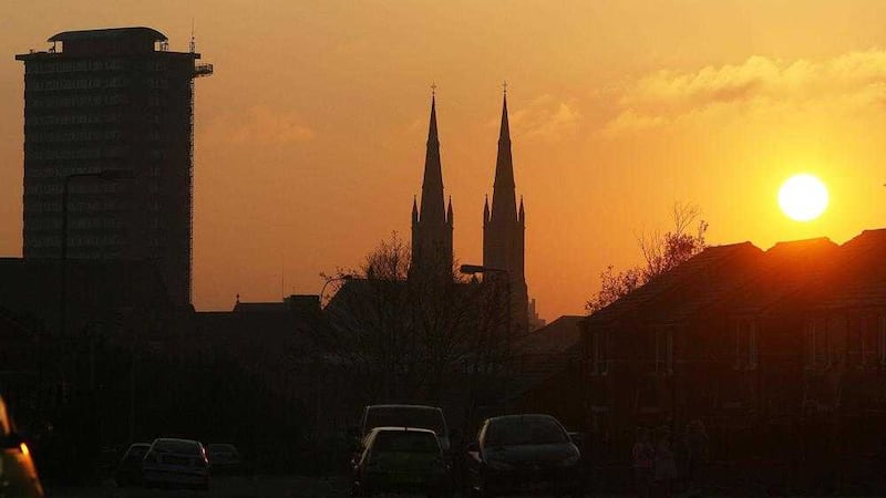 A winter sunset over St Peter&#39;s Cathedral and Divis Tower in west Belfast. Picture by Mal McCann 