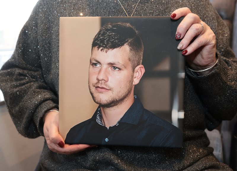 Gillian McCann holds a portrait of her late son Jay Woolsey who died from an accidental overdose in 2024. PICTURE:BRIAN LINCOLN