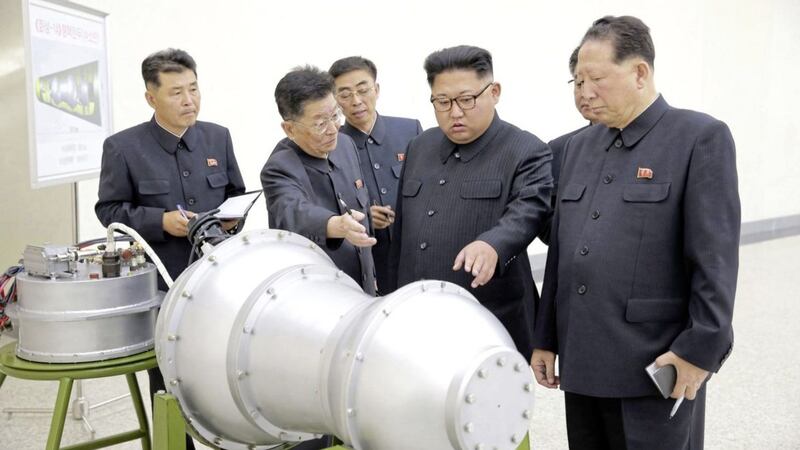 Political tension in North Korea (its leader Kim Jong Un is pictured here inspecting the loading of a hydrogen bomb into a new intercontinental ballistic missile) could weigh down on investor confidence 