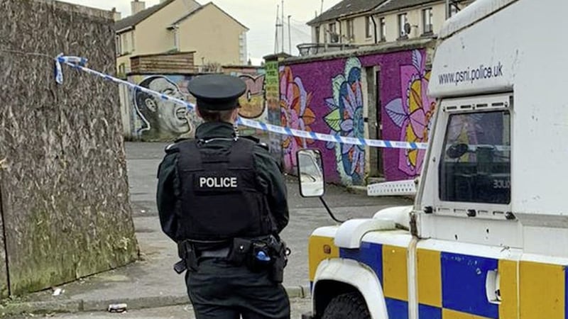 Police at the scene in the city&#39;s Creggan area following a double shooting 