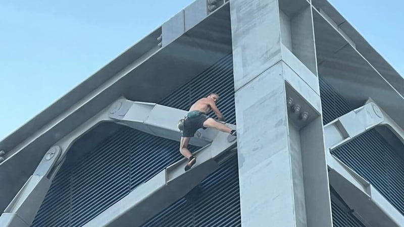 A shirtless man climbing the Cheesegrater in London (Theo Livesey/PA)