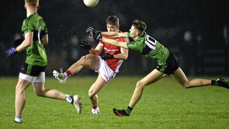 Ben Cullen of St Patricks Academy, Dungannon gets a shot away as Conan Devlin of Holy Trinity, Cookstown tries to block in last night's Danske Bank MacRory Cup Section C game at Eglish Picture: Oliver McVeigh 