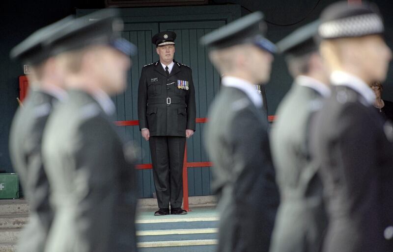 Former PSNI Chief Constable George Hamilton inspects recruits at the training college in Belfast 