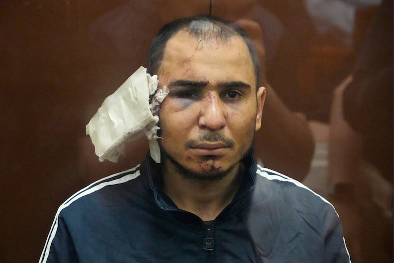 Saidakrami Murodali Rachabalizoda, a suspect in the Crocus City Hall shooting on Friday, had a heavily bandaged ear. Reports that one suspect had an ear cut off during interrogation could not be verified (AP Photo/Alexander Zemlianichenko)